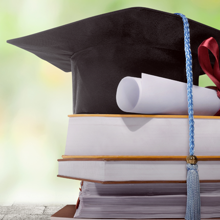 Graduation cap on top of books